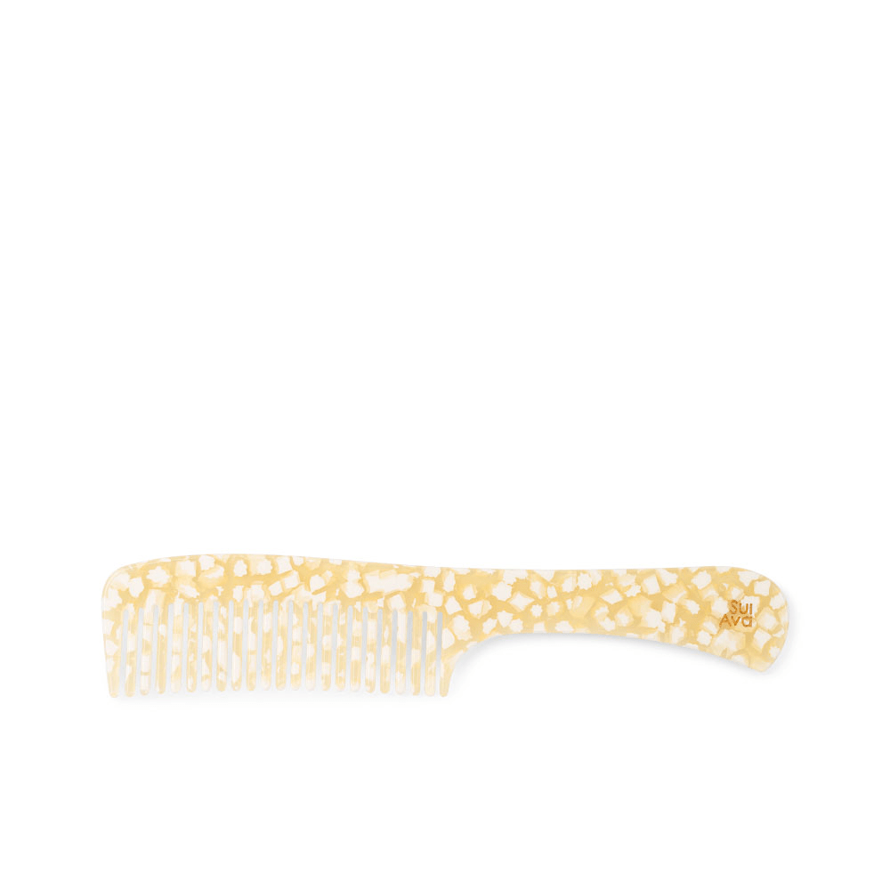 Elegant Comb Snowflake fra SUI AVA – gul og hvid kam med terrazzo-lignende mønster og SUI AVA logo