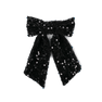 Anne Sequins Bow fra SUI AVA – smuk hårsløjfe med glitrende pailletter i en klassisk stil, ideel til at skabe et elegant og iøjnefaldende look.
