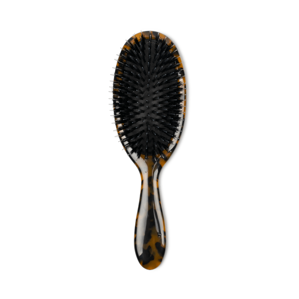 SUI AVA Brush – stilfuld og praktisk hårbørste designet til at skånsomt rede og style dit hår, perfekt til både hverdag og rejser.