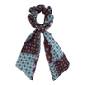 Angela Multi Scrunchie – turkis scrunchie med mønstret tørklæde og elegant design.