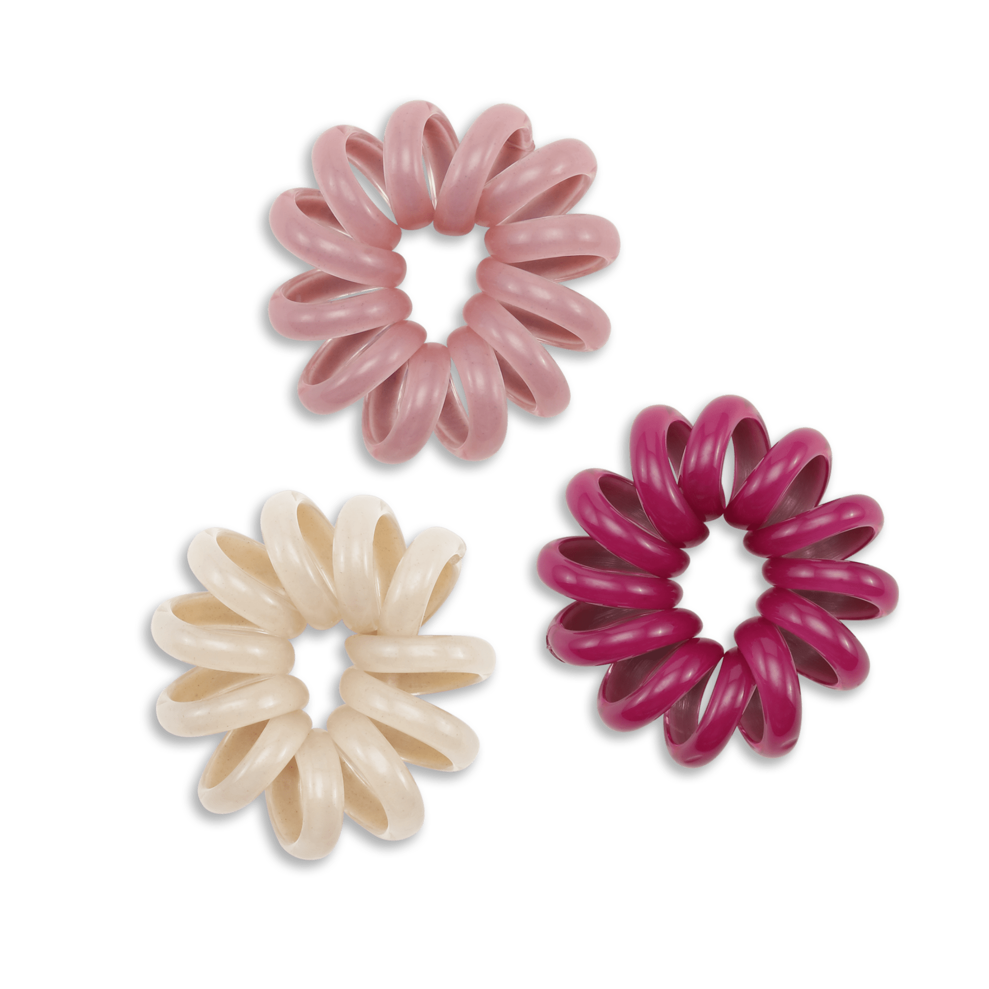 Tre spiralformede hårelastikker i perlemor, lyserød og mørk pink fra SUI AVA.